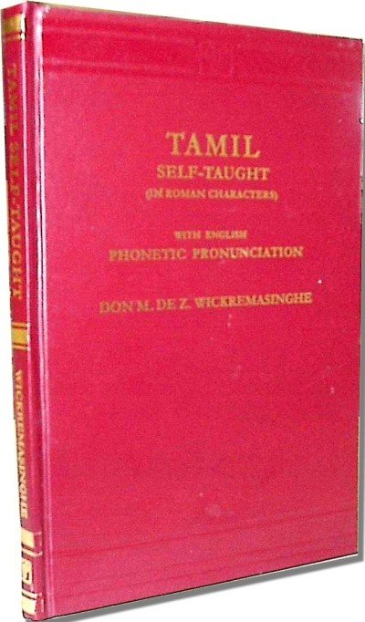 Red hardcover book titled 'Tamil Self-Taught on Roman Characters' with gold lettering, noting English phonetic pronunciation; by Don N. de Z. Wickremasinghe, standing upright.